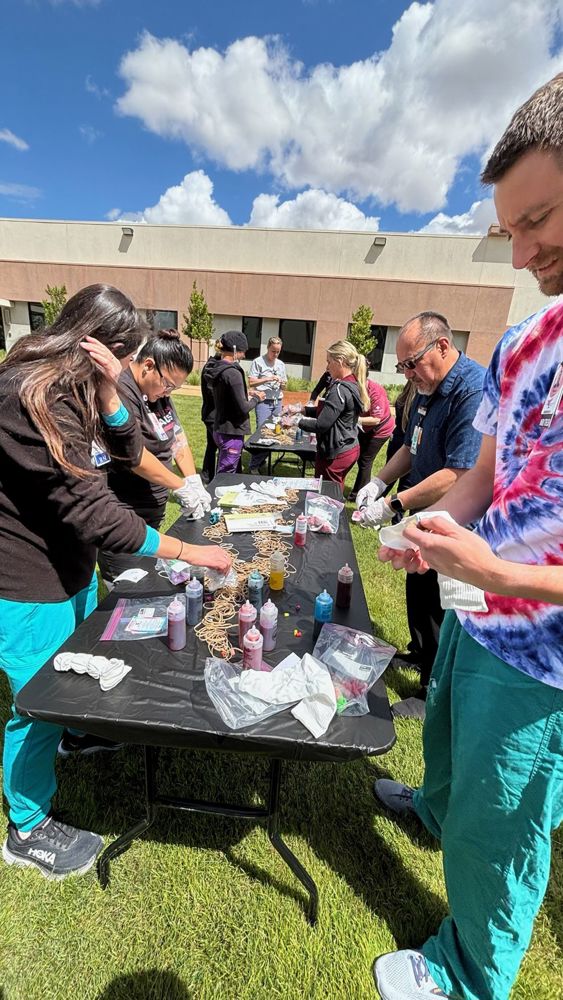 Hospital week workers picture doing tie dye